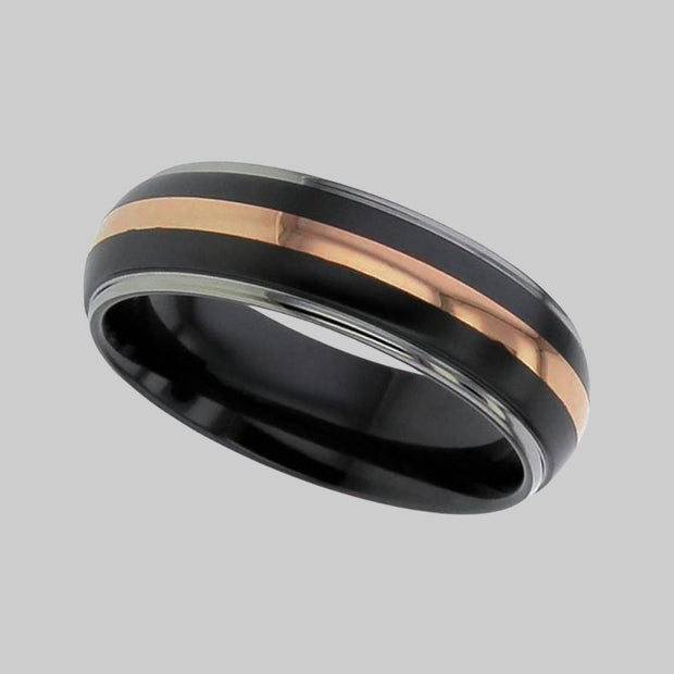 Shoulder cut dome profile relieved Black Zirconium ring with natural Zirconium edges and central precious rose gold metal inlay by FANCI Fine Jewellery, Southampton, UK.